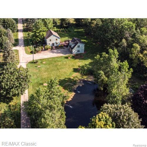 View of home overlooking Pond & fountains