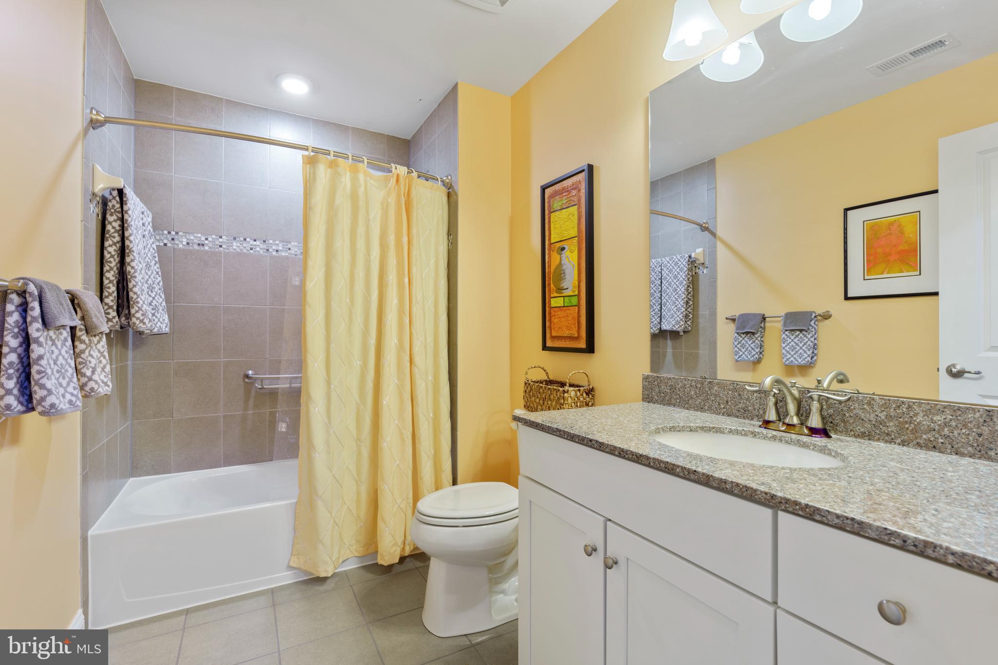 6926 Summit Circle Baltimore, MD 21239 - Photo 29 of 52 a bathroom with a granite countertop sink toilet and shower