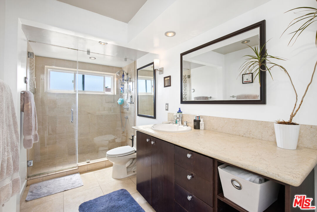 432 South Hamel Road, Unit 302 Los Angeles, CA 90048 - Photo 13 of 20 a bathroom with a sink vanity mirror and toilet