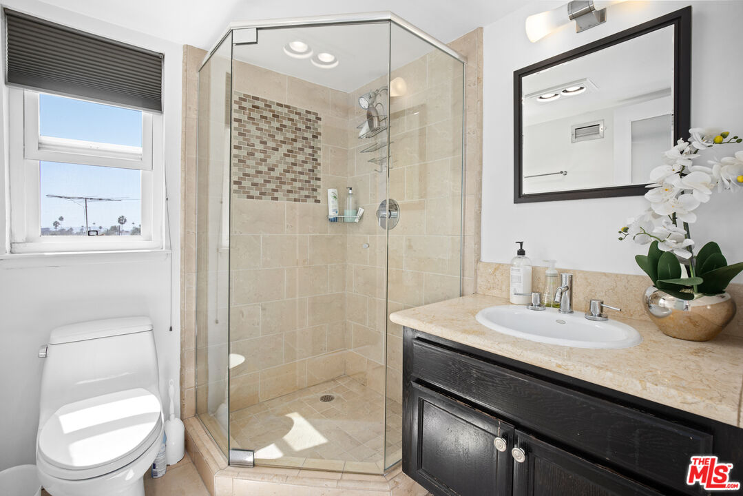 432 South Hamel Road, Unit 302 Los Angeles, CA 90048 - Photo 16 of 20 a bathroom with a sink a toilet and shower