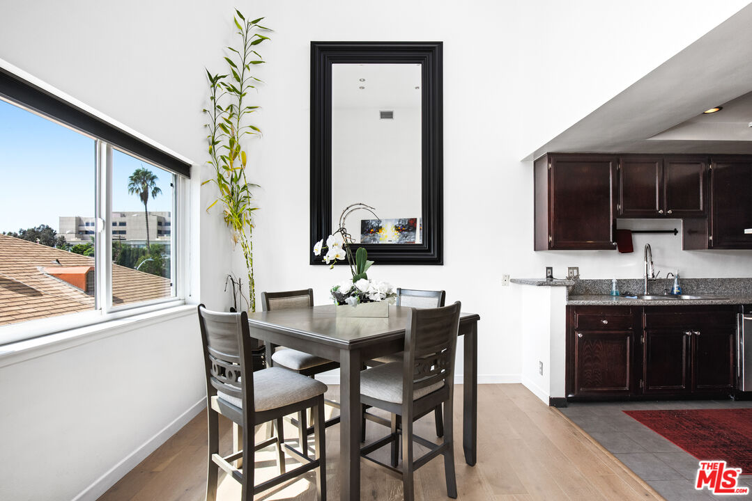 432 South Hamel Road, Unit 302 Los Angeles, CA 90048 - Photo 6 of 20 a view of a dining room with furniture and window
