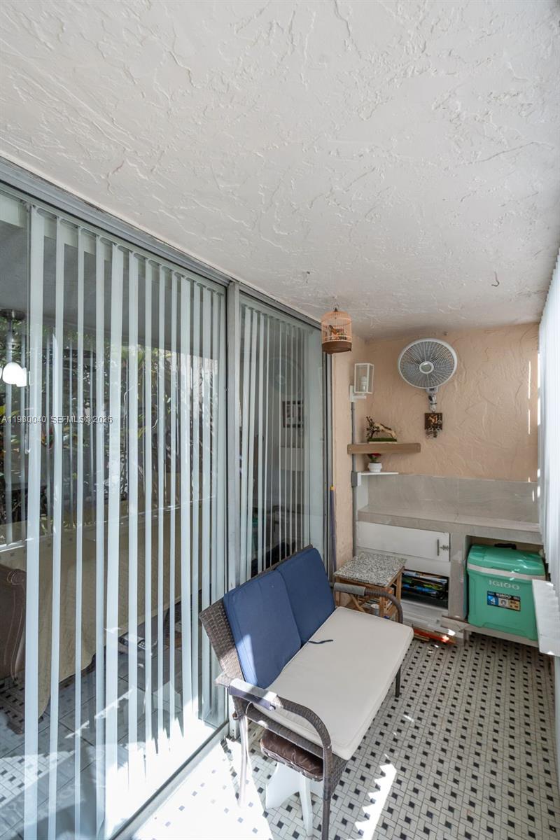 8405 Northwest 8th Street, Unit 1072 Miami, FL 33126 - Photo 15 of 33 a living room with furniture and a window