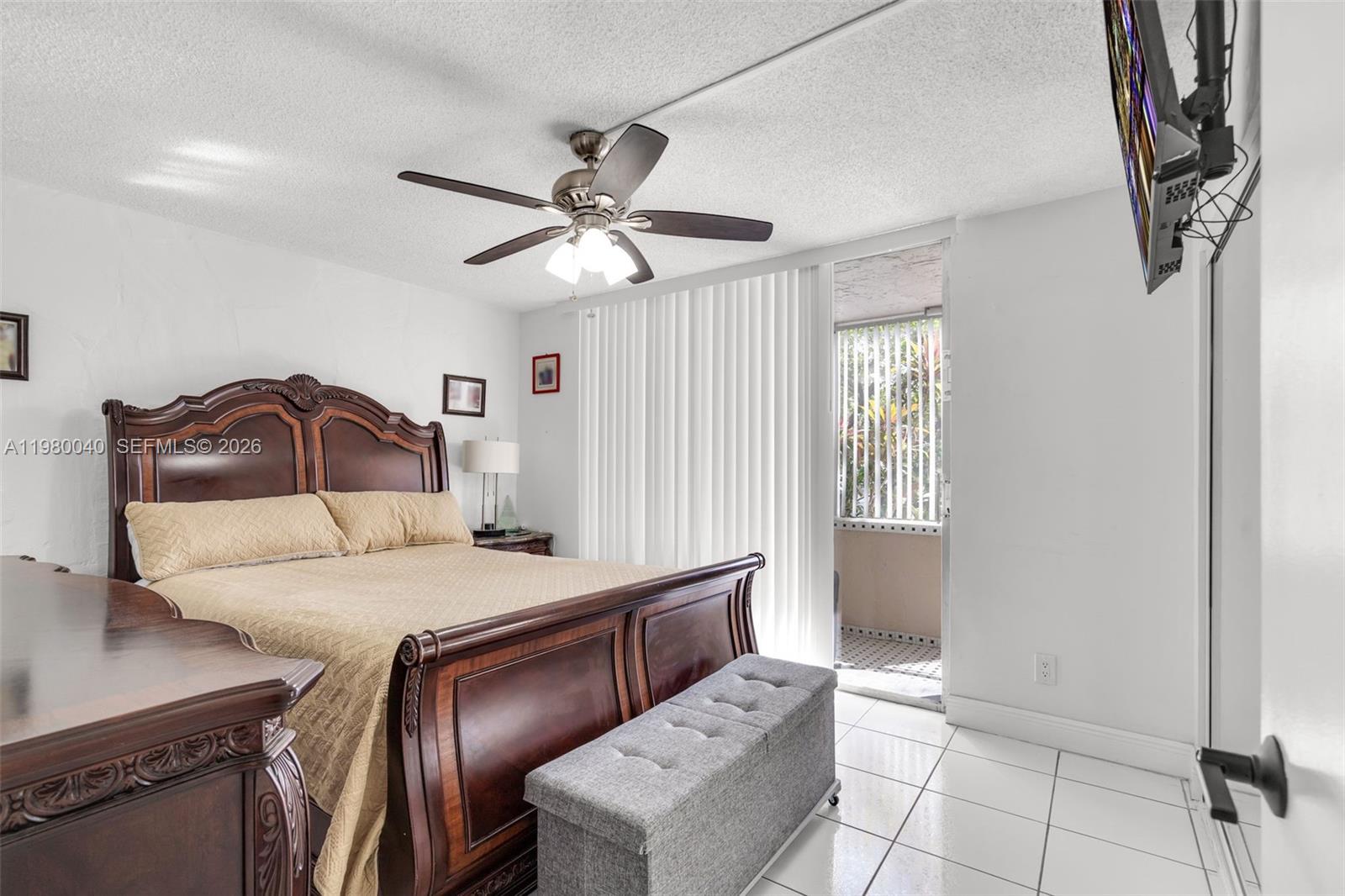 8405 Northwest 8th Street, Unit 1072 Miami, FL 33126 - Photo 20 of 33 a bedroom with a bed and a chandelier