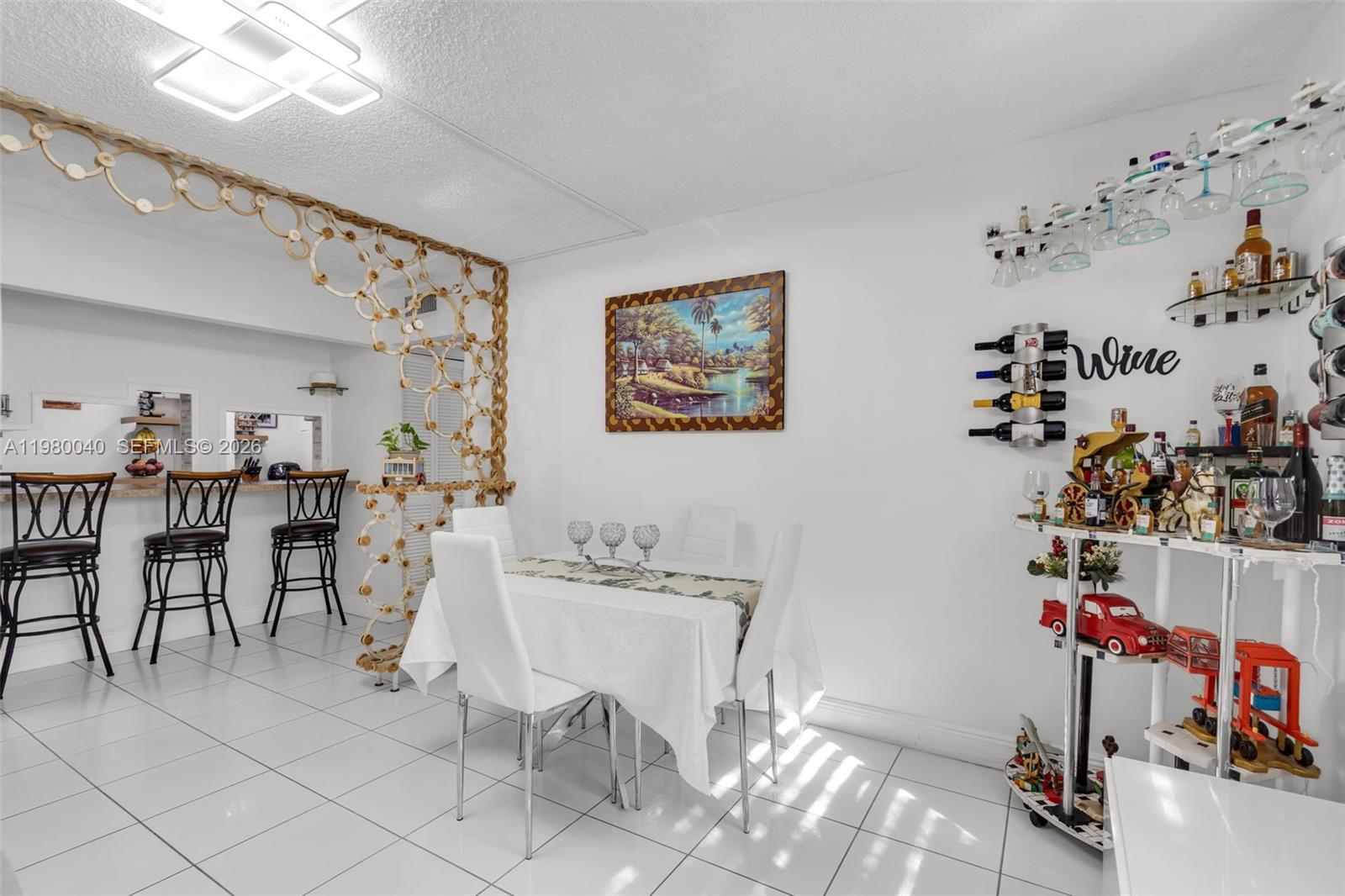 8405 Northwest 8th Street, Unit 1072 Miami, FL 33126 - Photo 25 of 33 a view of a dining room with furniture and toys