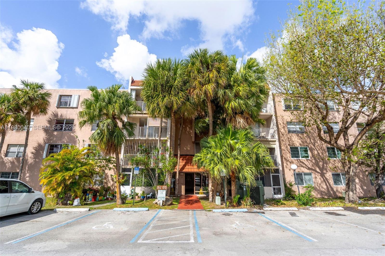 8405 Northwest 8th Street, Unit 1072 Miami, FL 33126 - Photo 31 of 33 a view of street along with trees