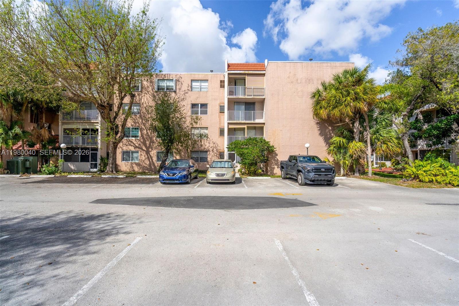 8405 Northwest 8th Street, Unit 1072 Miami, FL 33126 - Photo 32 of 33 a car parked in front of a building