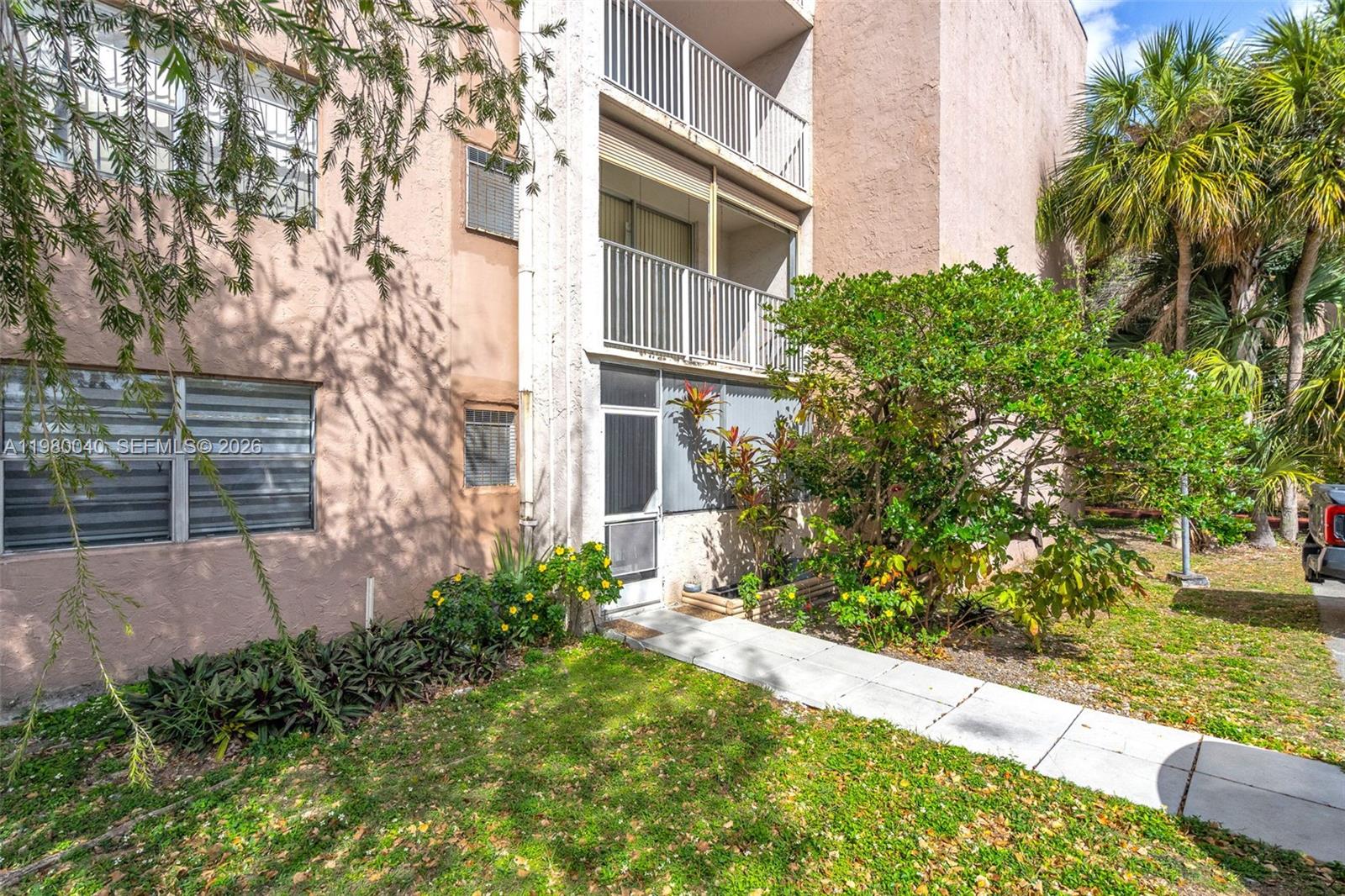 8405 Northwest 8th Street, Unit 1072 Miami, FL 33126 - Photo 33 of 33 front view of a house with a yard