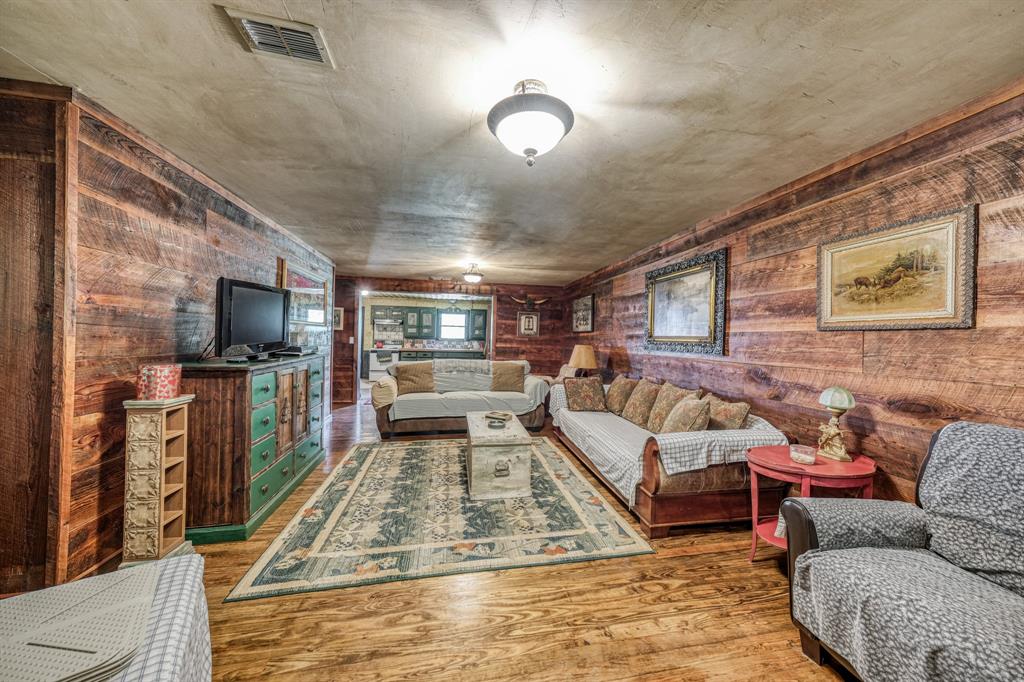 8601 Star Hollow Road Lipan, TX 76462 - Photo 13 of 40 a living room with furniture and a flat screen tv