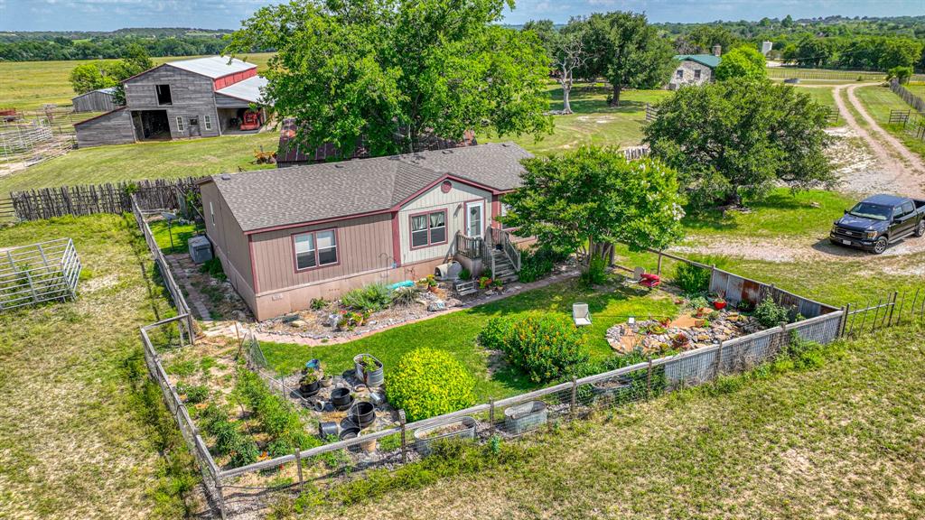 8601 Star Hollow Road Lipan, TX 76462 - Photo 20 of 40 an aerial view of a house with a garden and lake view