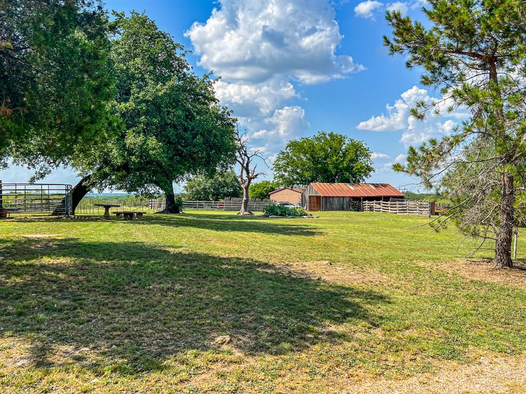 8601 Star Hollow Road Lipan, TX 76462 - Photo 31 of 40 a view of a house with a big yard