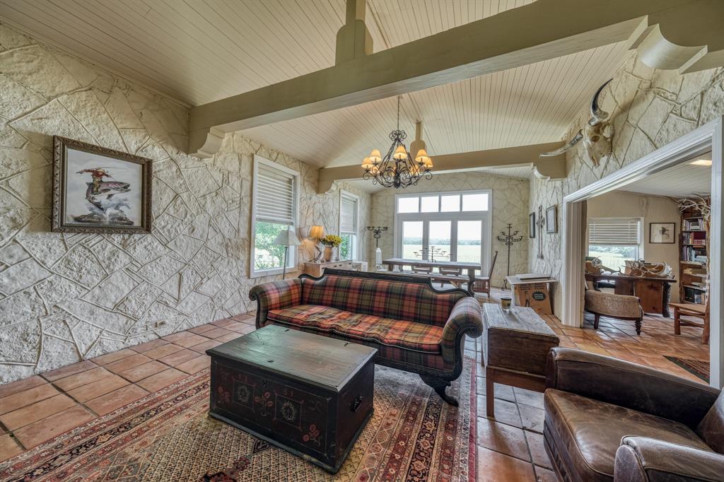 8601 Star Hollow Road Lipan, TX 76462 - Photo 4 of 40 a living room with furniture and a chandelier