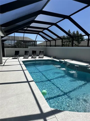 a view of a swimming pool with a patio
