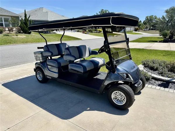 an outdoor space with furniture and umbrella