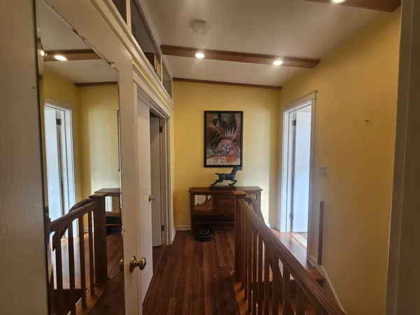 a bedroom with a bed couch and window