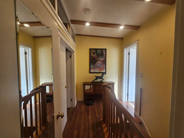 a bedroom with a bed couch and window