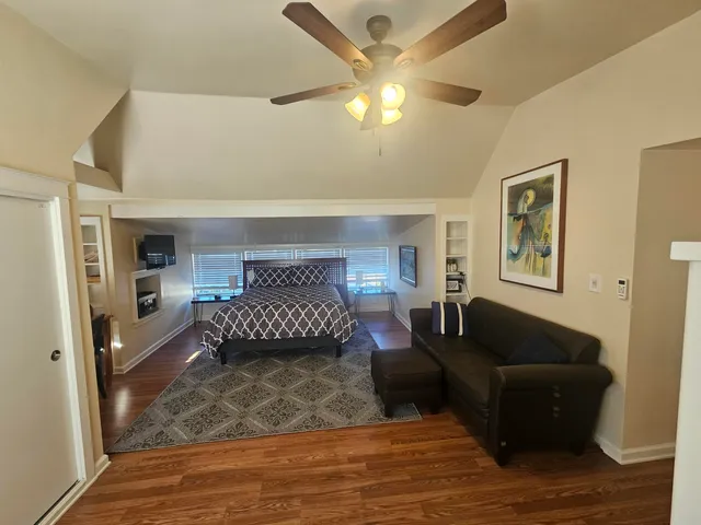 a bathroom with bathtub and window