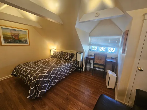 a view of deck with a floor to ceiling window and wooden fence