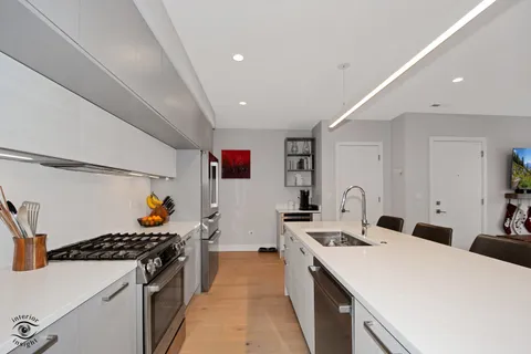 a kitchen that has a sink and a stove