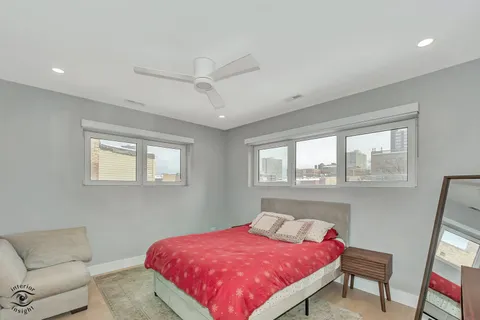 a bedroom with a bed and a couch