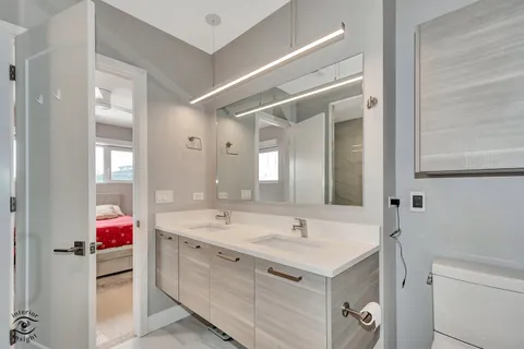 a bathroom with a sink vanity and mirror