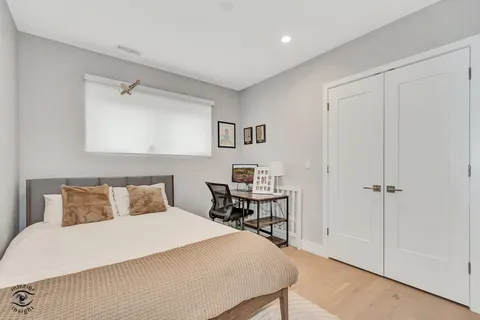 a bedroom with a bed and a table in it