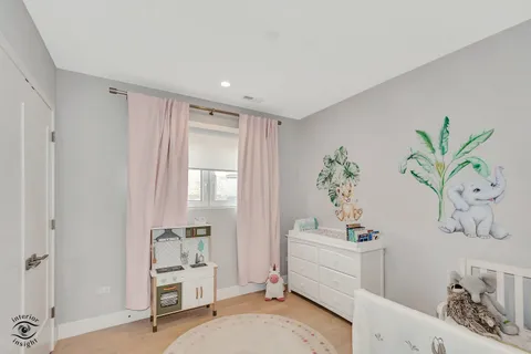 a bathroom with a bathtub a sink a window and a shower