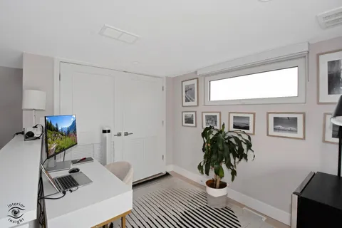 a view of workspace with a window and couch