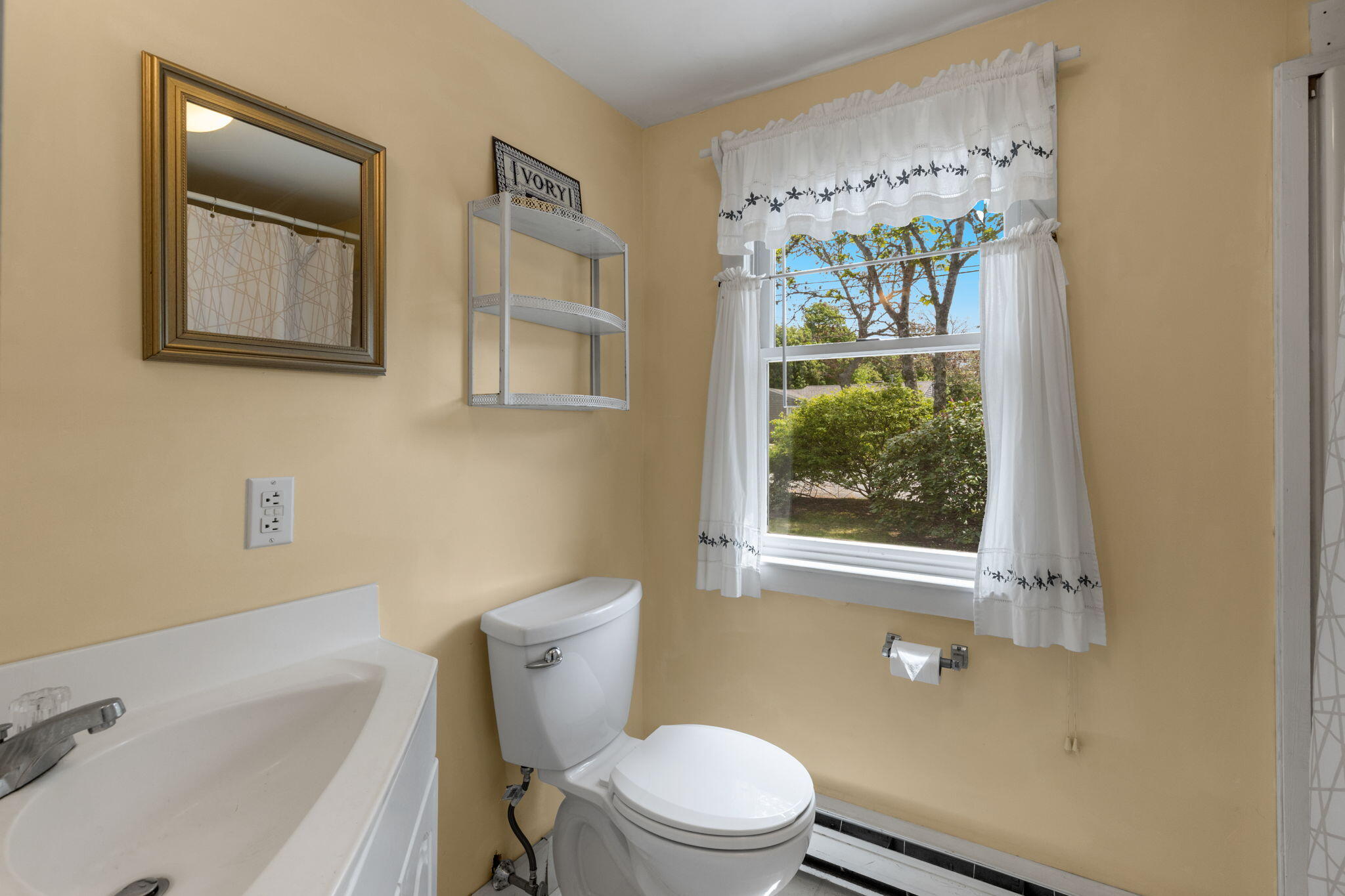 7 Aunt Matties Road Chatham, MA 02633 - Photo 24 of 37 a white toilet sitting next to a bath tub