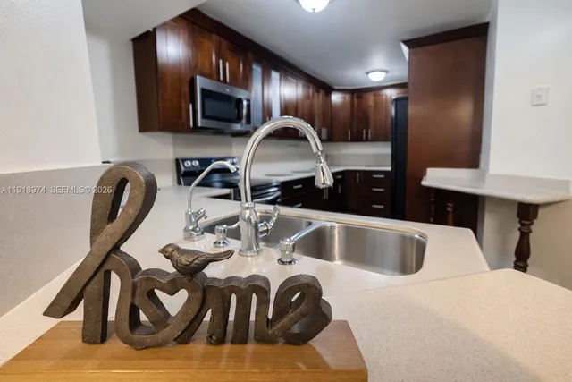 a kitchen with a sink and cabinets