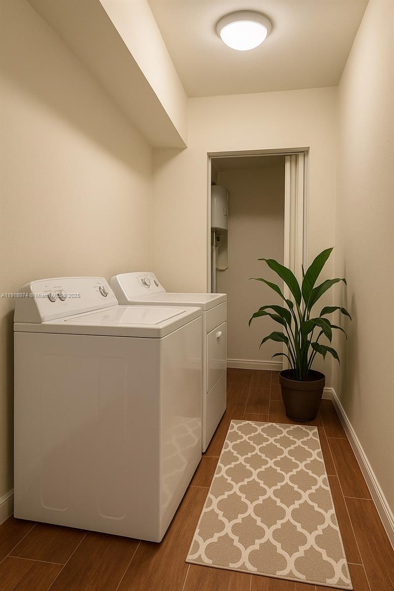 8801 Wiles Road, Unit 307 Coral Springs, FL 33067 - Photo 9 of 10 a utility room with washer and dryer