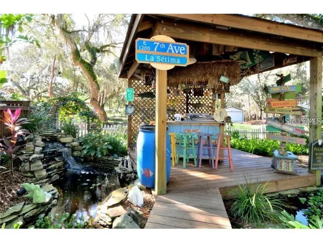 a view of a chair and table in the backyard