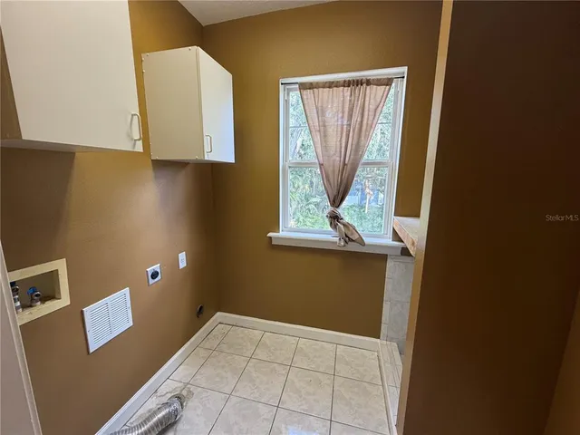 a view of a field with some trees