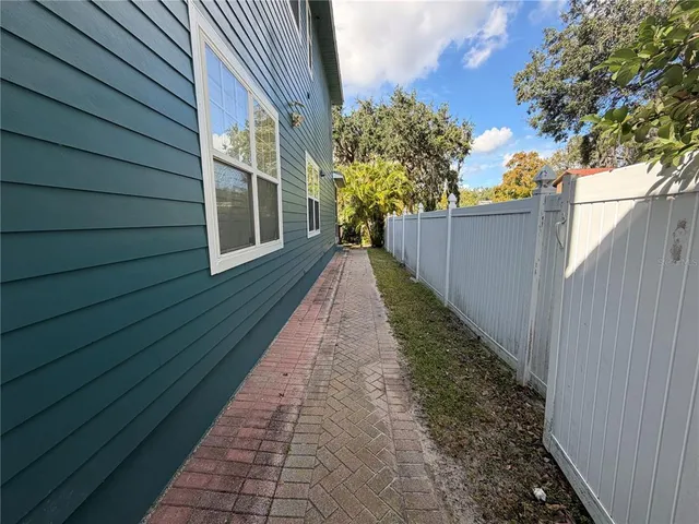 a backyard of a house with lots of green space