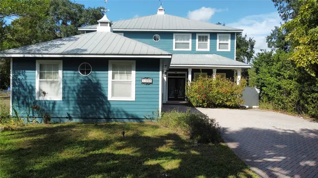 a kitchen with white cabinets and a sink