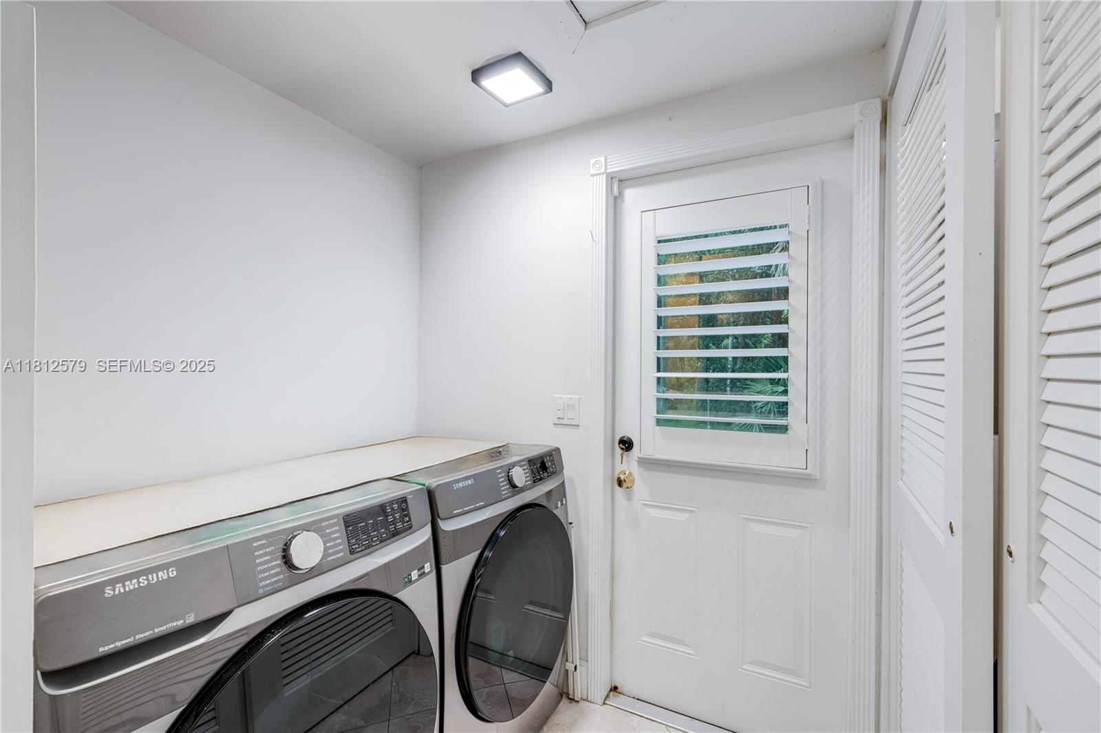 7900 Southwest Springhaven Avenue Indiantown, FL 34956 - Photo 15 of 38 a utility room with dryer and washer