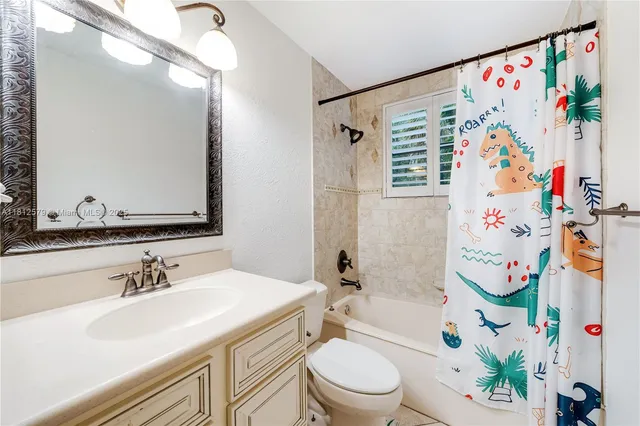 a bathroom with a sink a toilet and a bathtub