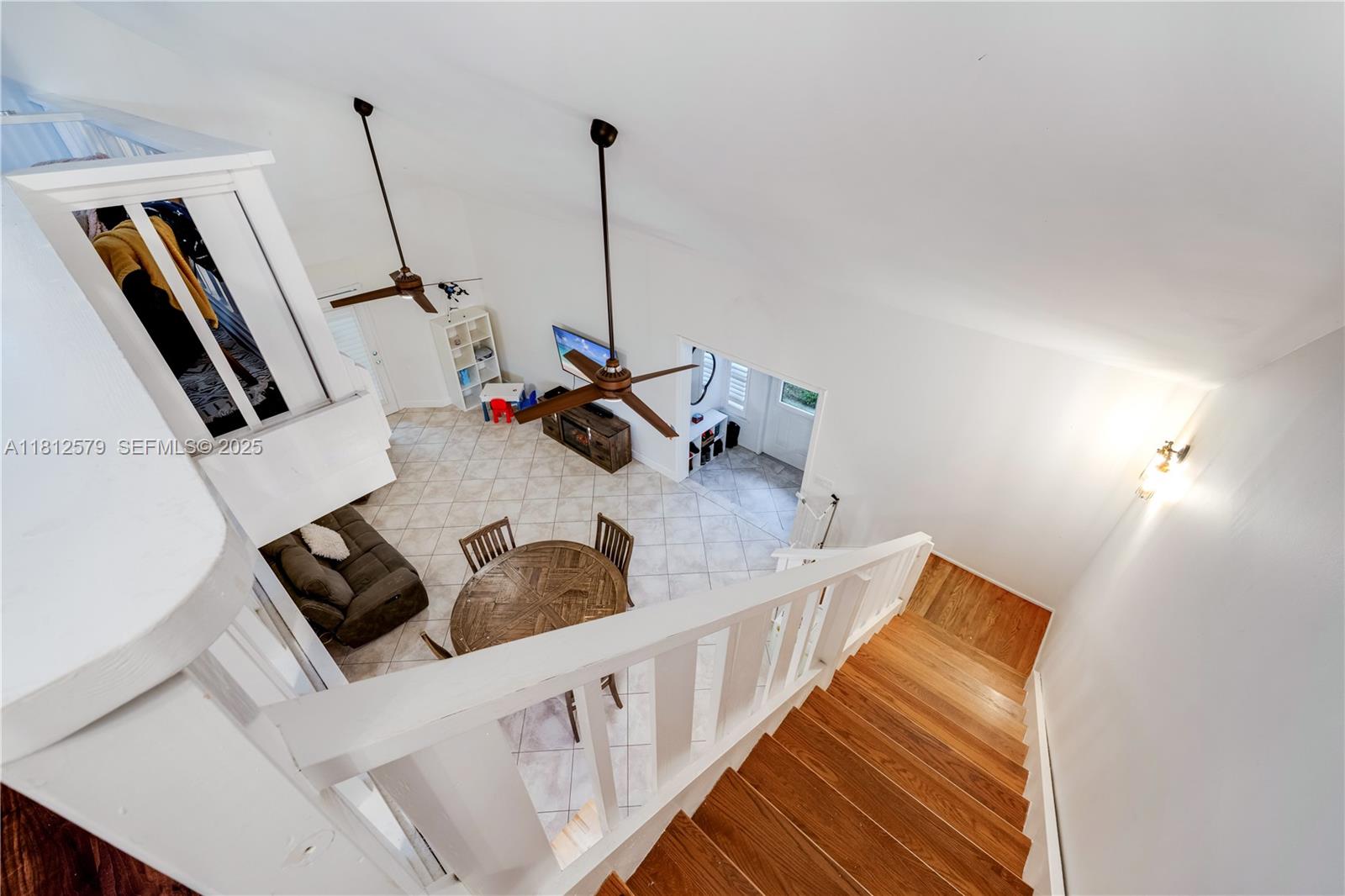 7900 Southwest Springhaven Avenue Indiantown, FL 34956 - Photo 19 of 38 a living room with furniture and a wooden floor