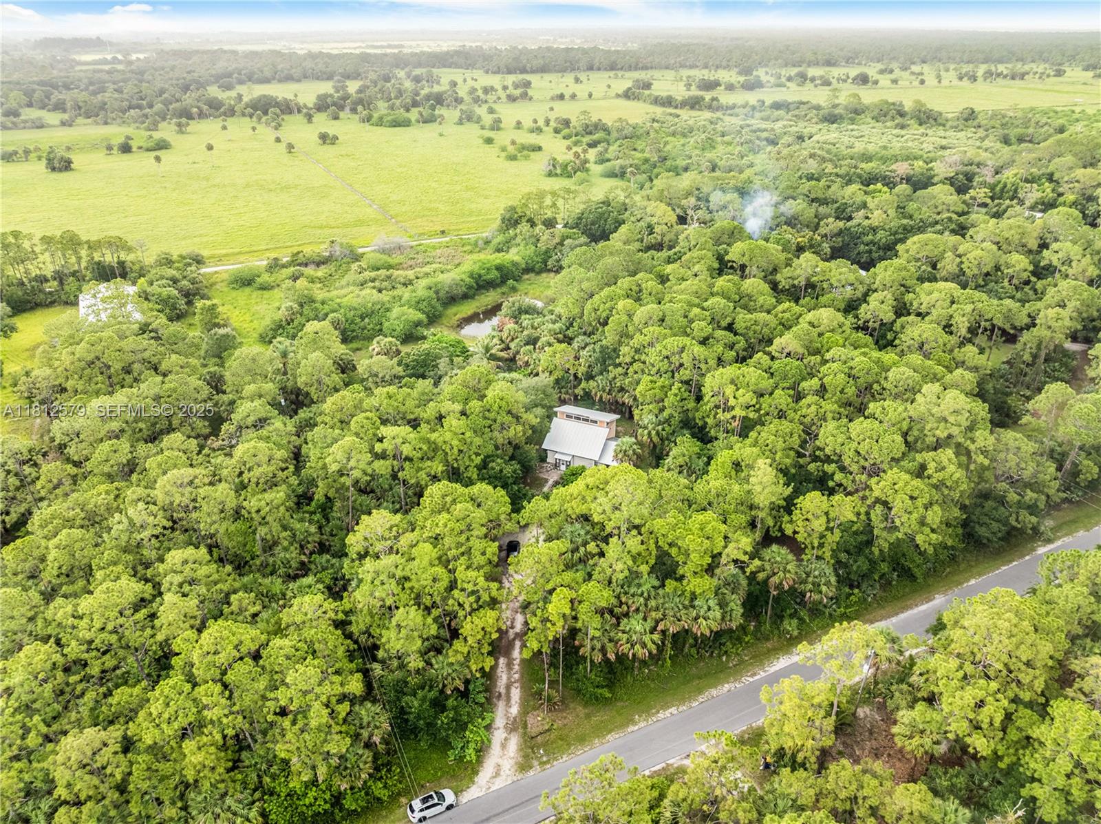 7900 Southwest Springhaven Avenue Indiantown, FL 34956 - Photo 27 of 38 a view of a lake with a city