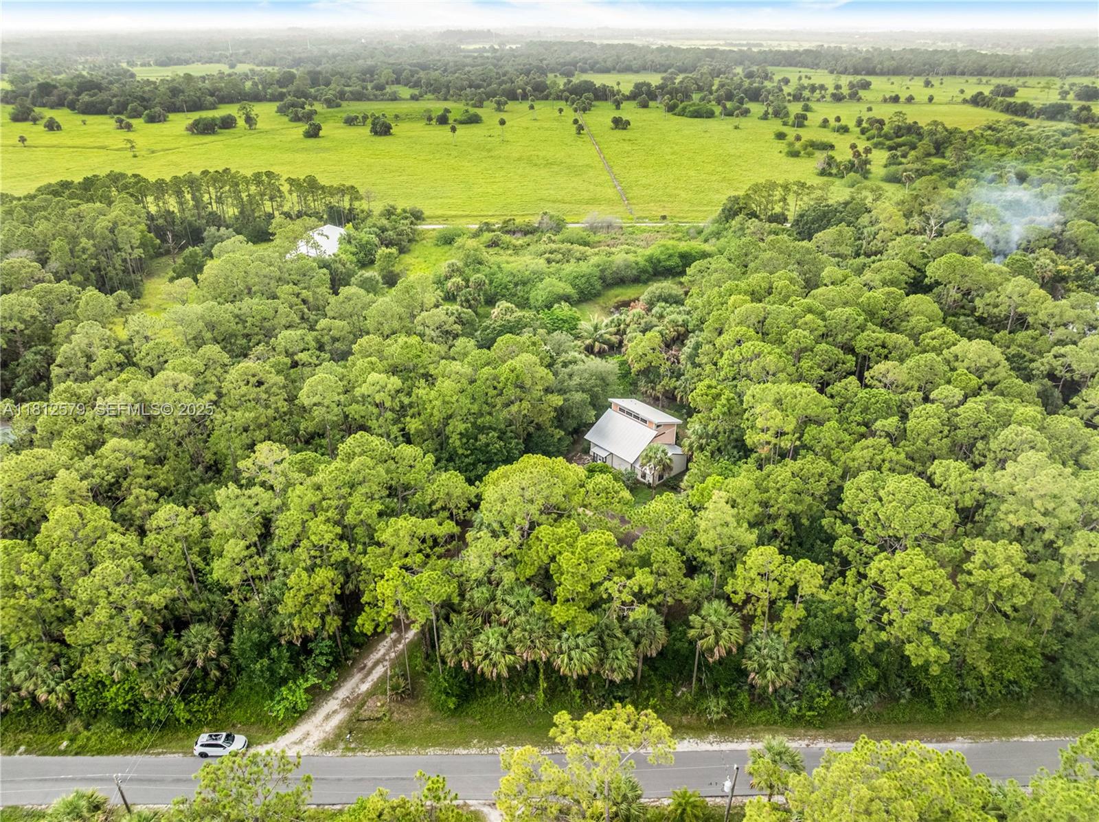 7900 Southwest Springhaven Avenue Indiantown, FL 34956 - Photo 28 of 38 a view of a yard with an outdoor space