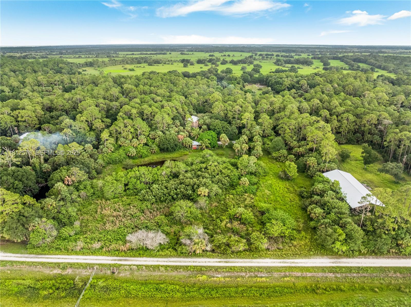 7900 Southwest Springhaven Avenue Indiantown, FL 34956 - Photo 31 of 38 a view of a garden with an outdoor space
