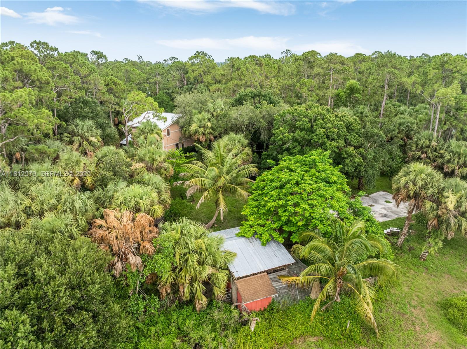 7900 Southwest Springhaven Avenue Indiantown, FL 34956 - Photo 34 of 38 an aerial view of a house with yard