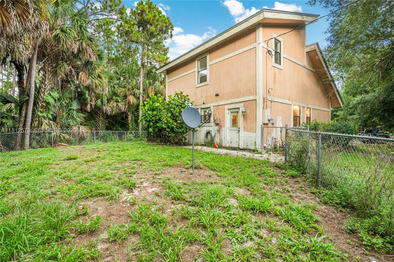 7900 Southwest Springhaven Avenue Indiantown, FL 34956 - Photo 36 of 38 a view of a house with backyard and garden