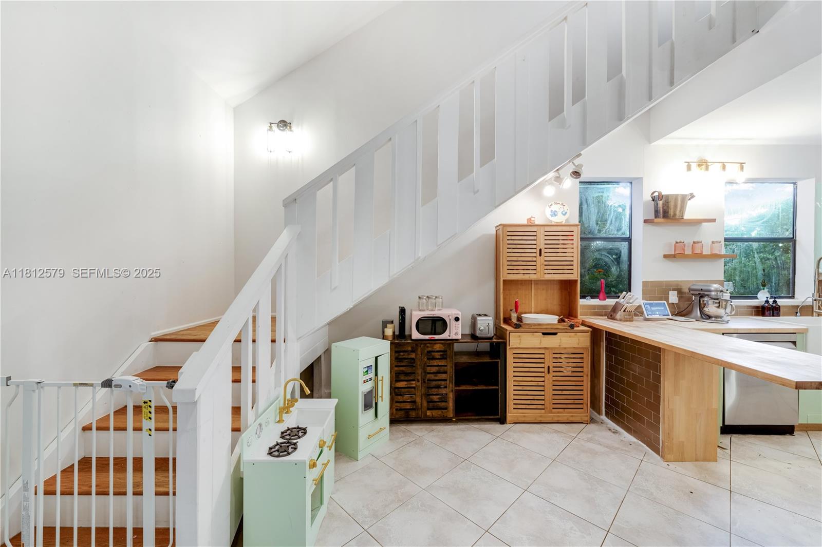 7900 Southwest Springhaven Avenue Indiantown, FL 34956 - Photo 10 of 38 a view of a kitchen with furniture and staircase