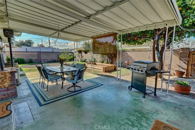 a view of a backyard with sitting area