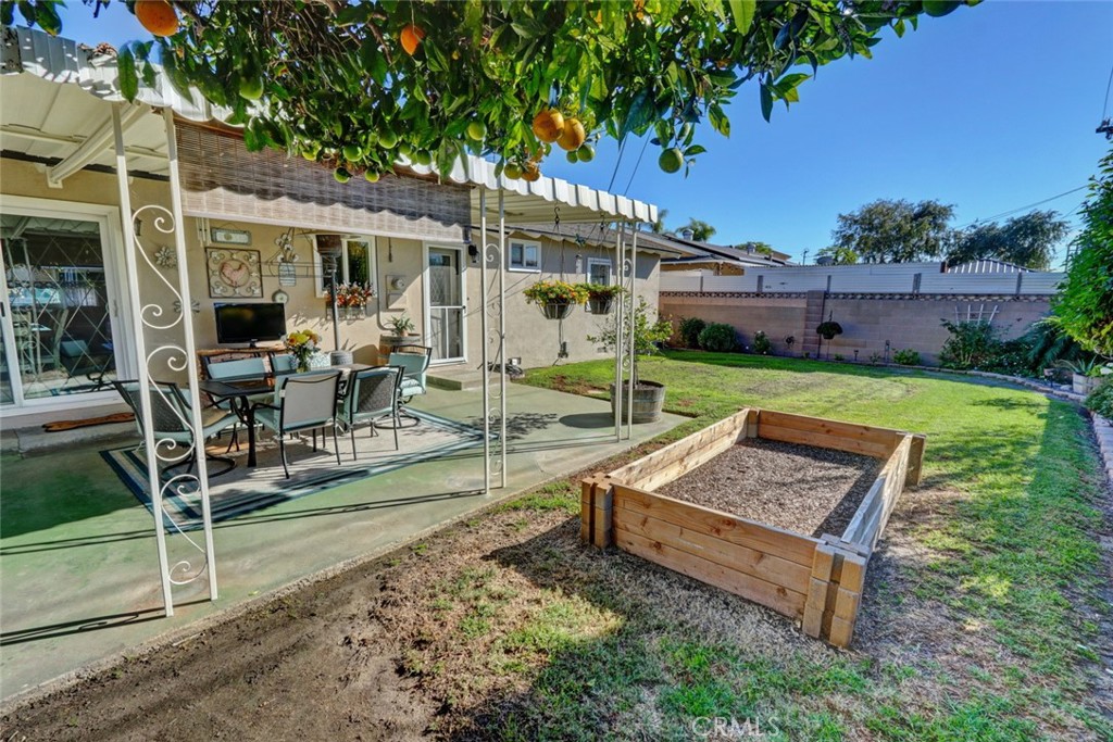 10291 Wyatt Road Stanton, CA 90680 - Photo 17 of 36 a view of a house with backyard sitting area and garden