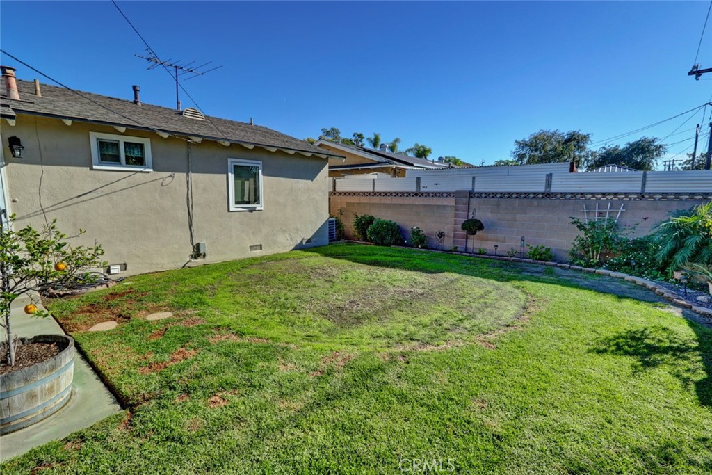 10291 Wyatt Road Stanton, CA 90680 - Photo 19 of 36 a view of a backyard with plants and a garden