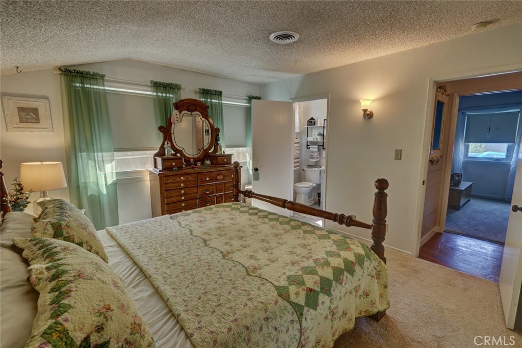 10291 Wyatt Road Stanton, CA 90680 - Photo 28 of 36 a bedroom with a bed and a dresser