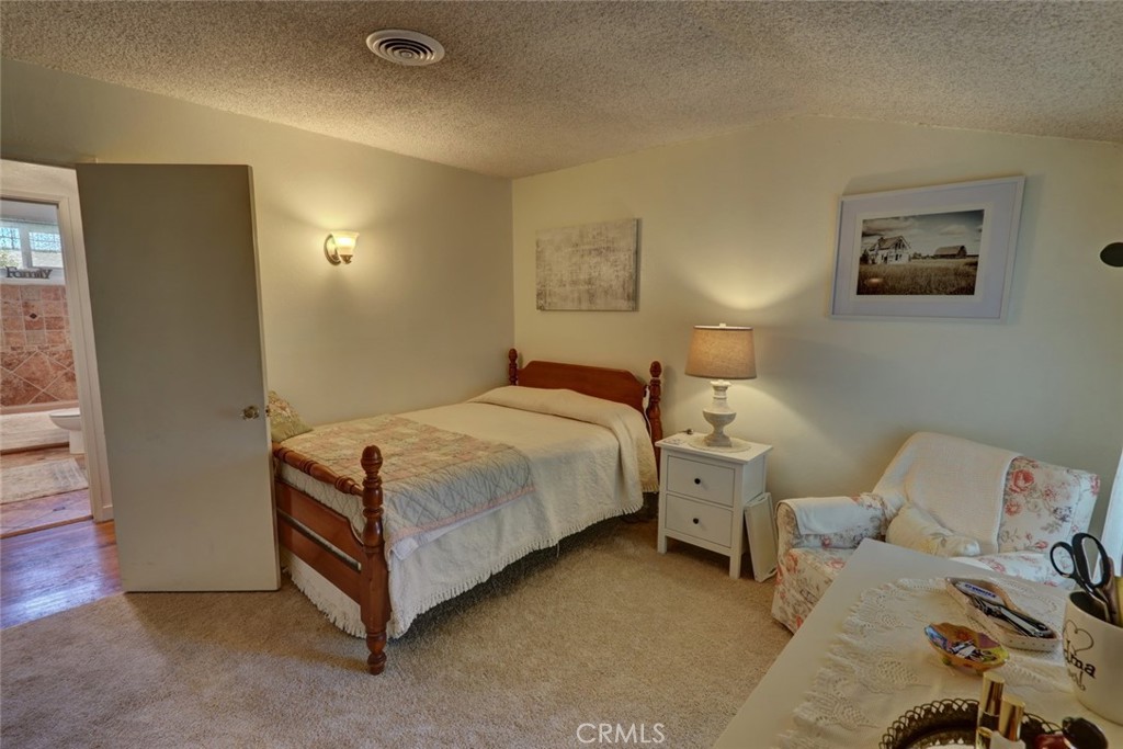 10291 Wyatt Road Stanton, CA 90680 - Photo 31 of 36 a spacious bedroom with a bed and a window