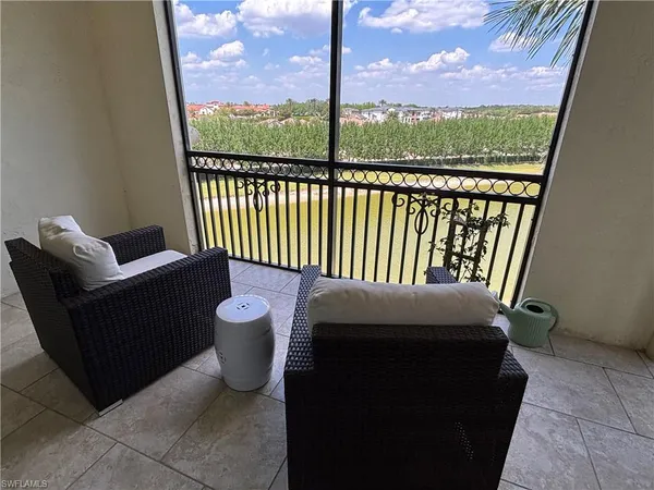 a view of a chair and table in the balcony