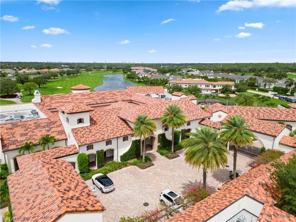 a view of a swimming pool and an outdoor seating